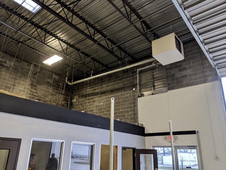 A unit heater and controls in a commercial ceiling
